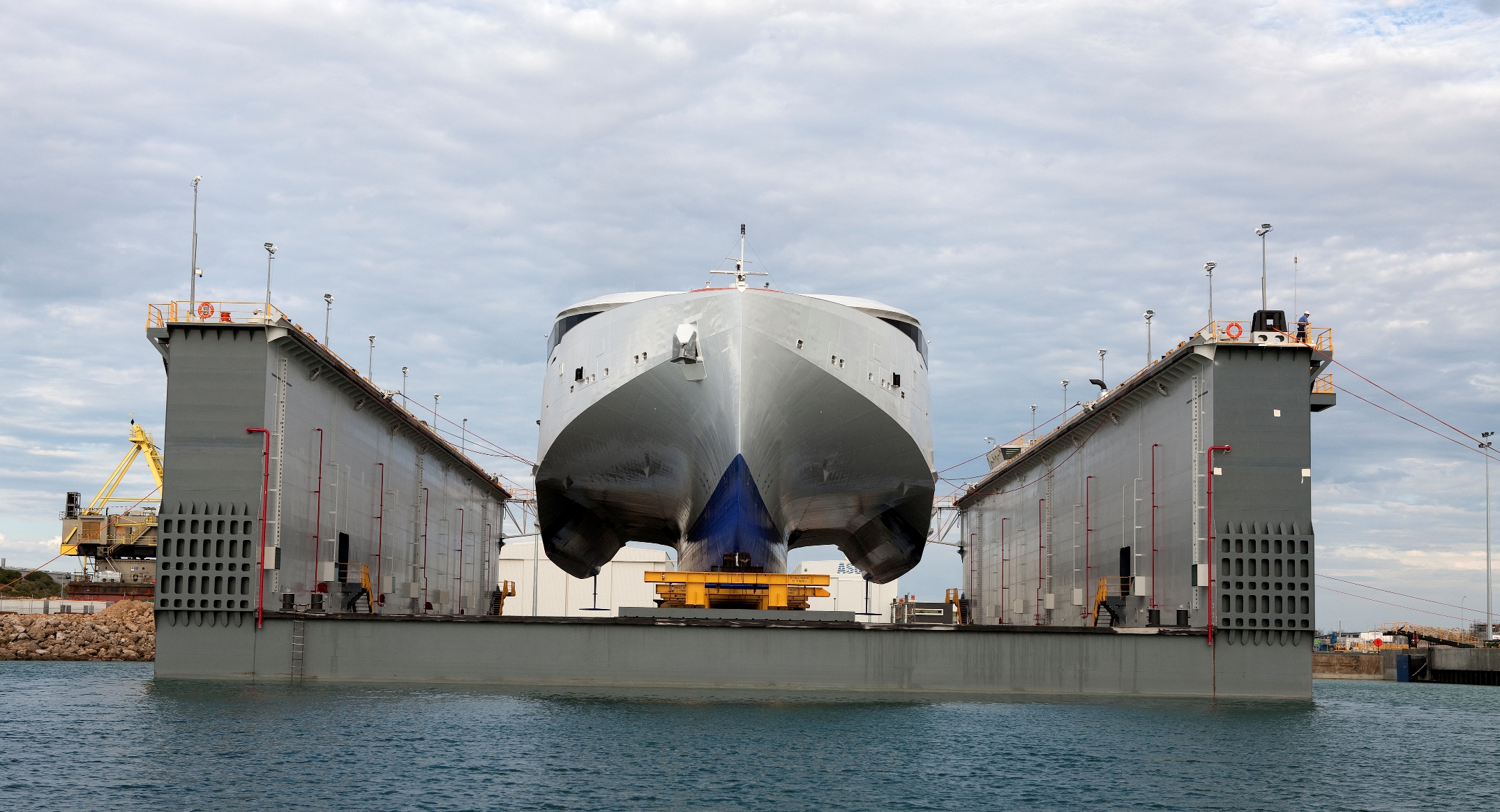 Image of a ship being serviced by Austal.