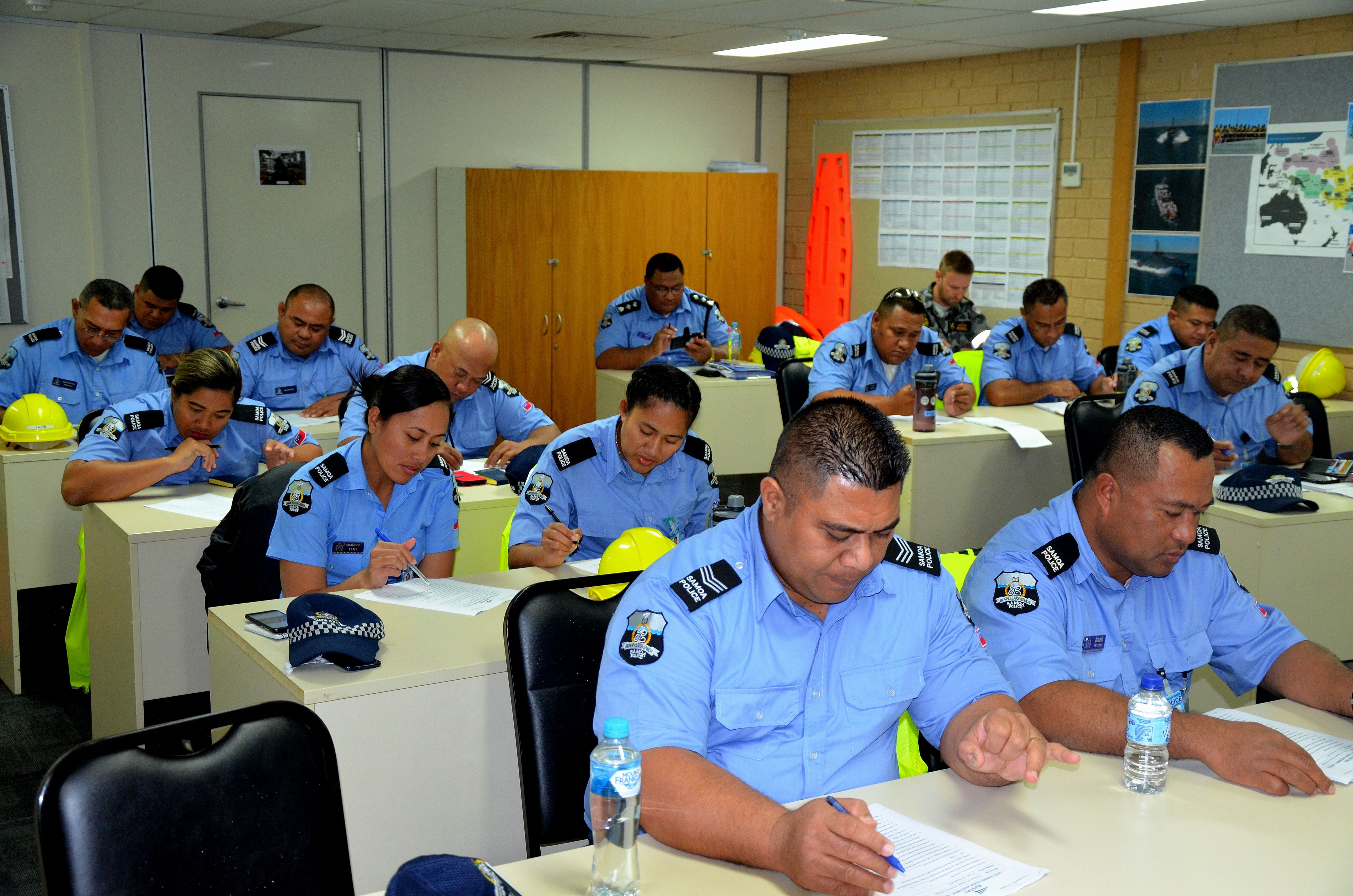 Image of Samoa police in a classroom during training delivered by Austal.