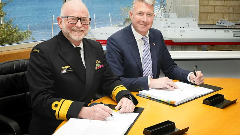 Image of RADM Michael Houghton, Head Patrol Boats and Specialist Ships, Naval Shipbuilding and Sustainment Group (NSSG), Department of Defence and Paddy Gregg, Austal Limited CEO signing the Strategic Shipbuilding Agreement (SSA) between the Commonwealth and Austal Defence Australia on 28th August 2025. (Photo credit: Australian Department of Defence)