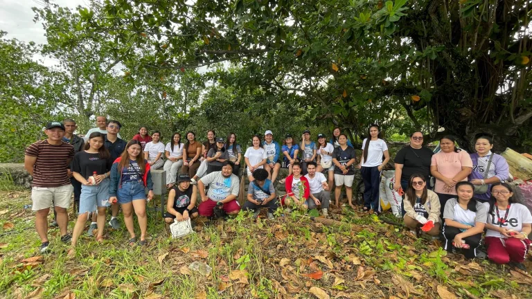 Image of Austal Philippines employees taking part of a coastal clean-up, part of our Austal Community Engagement Program