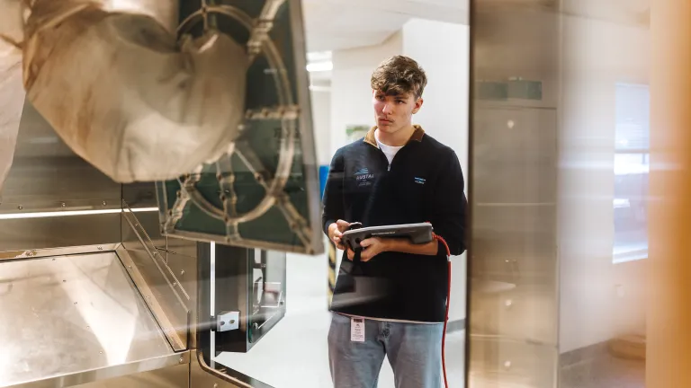 Image of an Austal USA employee working at the additive manufacturing facility in Charlottesville.