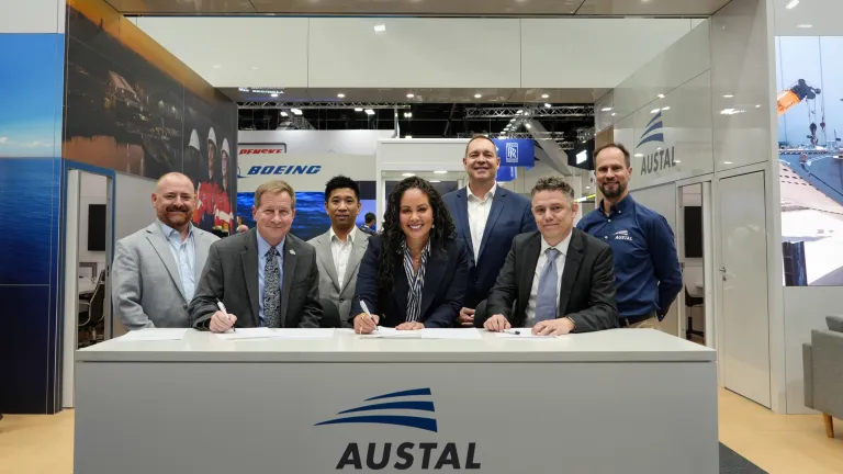 Image of Austal USA, Australia and ASC Pty Ltd representatives signing an MOU at Indo Pacific 2025.