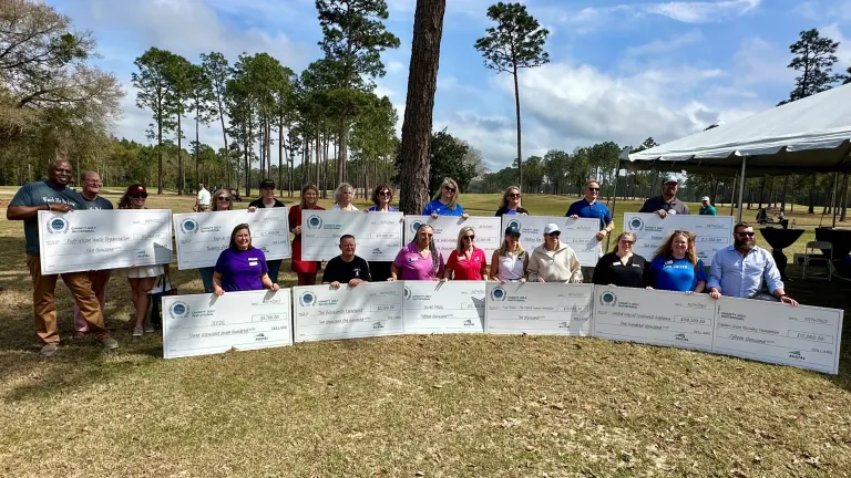Image of a group of people attending Austal USA's annual charity golf invitational
