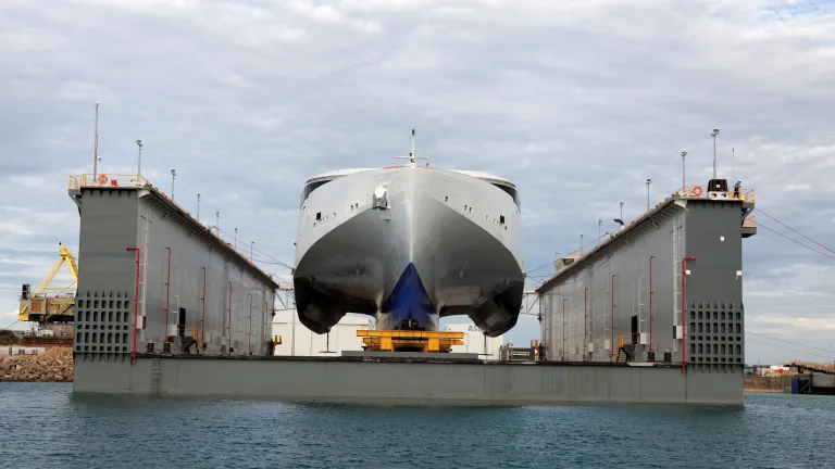 Image of a ship being serviced by Austal.