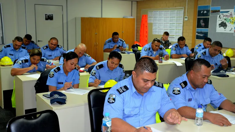 Image of Samoa police in a classroom during training delivered by Austal.