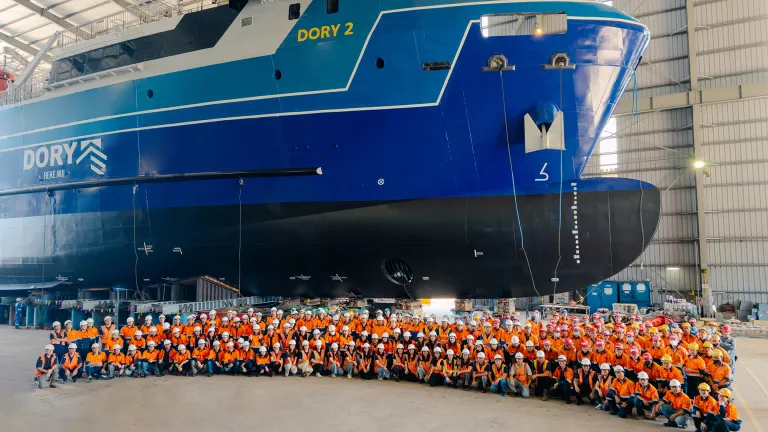 Image of Vietnam team alongside Dory 2, ahead of the vessel's launch in March 2026.