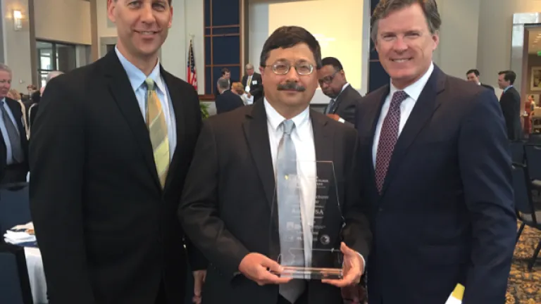 Austal Employees Craig Savage and Mike Bell and AL Senator Bill Hightower with Austal's 2016 AL Manufacturer of the Year Award.png