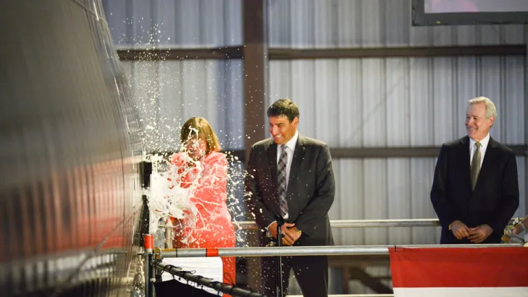 USNS Brunswick (JHSV 6) Christening - Lee Booterbaugh breaking bottle (2).jpg