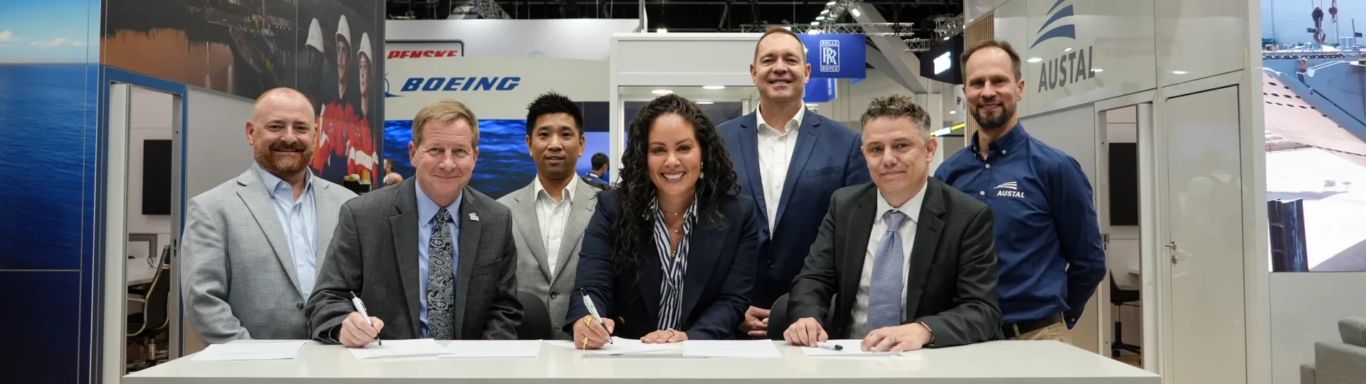 Image of Austal USA, Australia and ASC Pty Ltd representatives signing an MOU at Indo Pacific 2025.